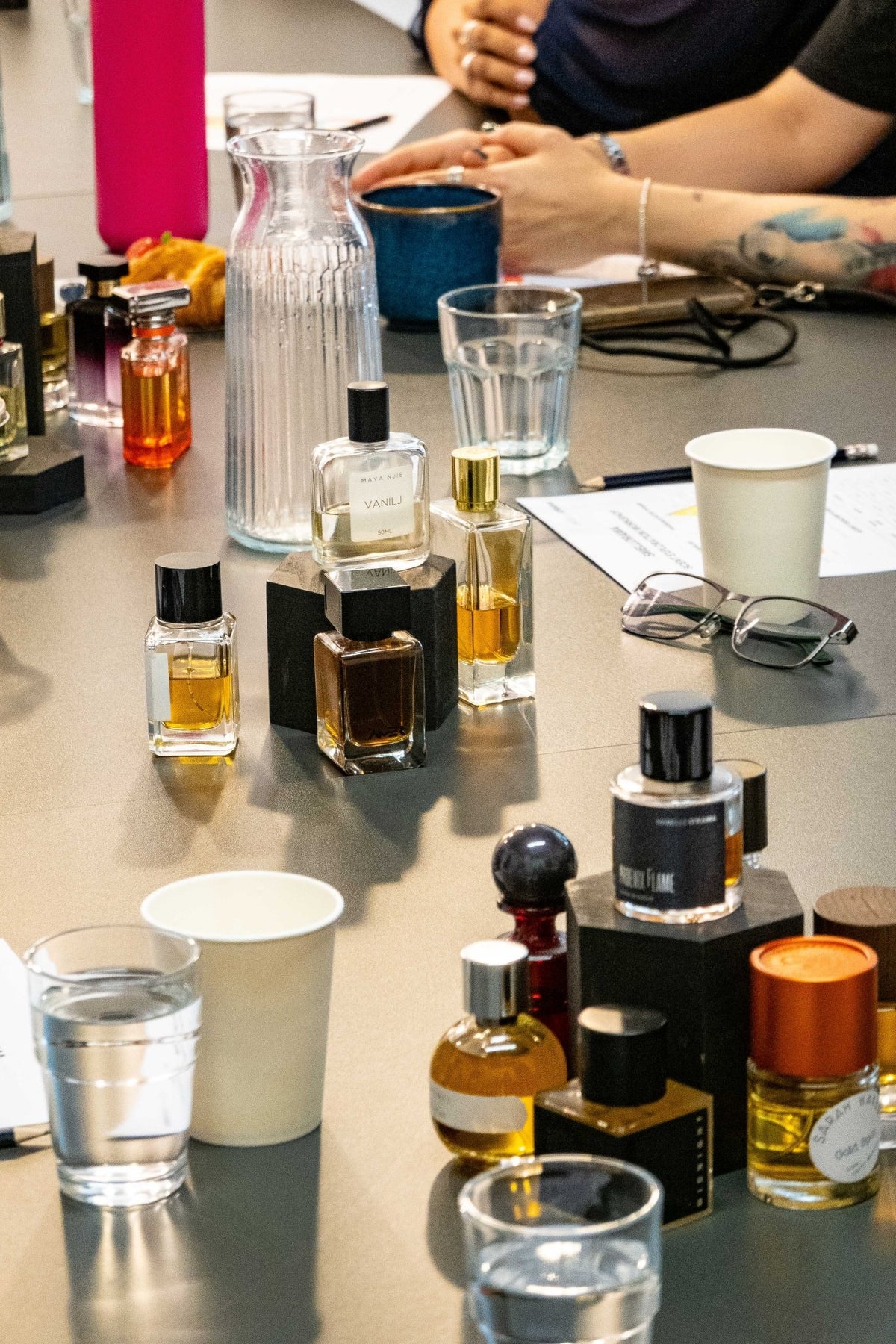 Perfume bottles from around the world on the workshop table